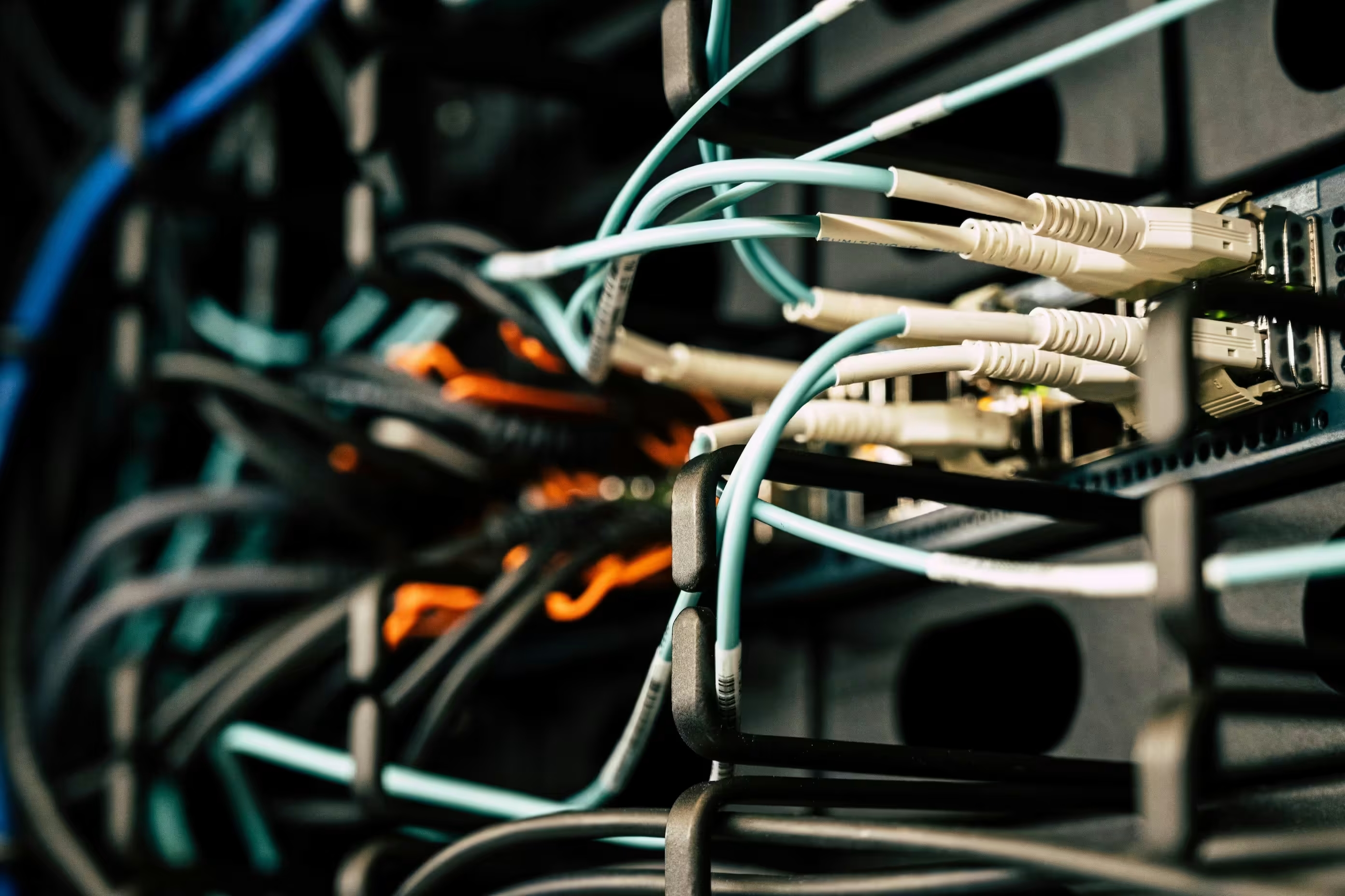 A professional network setup in a data cabinet with well-organized cables.